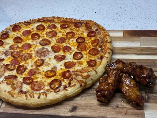 Two 16in Chz/Pepp. Pizzas, 12 Wings, 6 Sodas